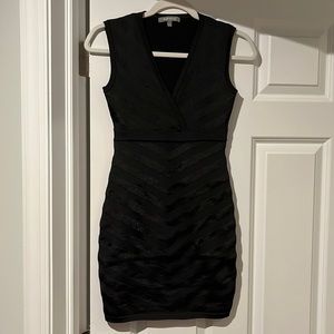 Size small bandage dress hits a few inches above the knee on me (5’5). Worn once